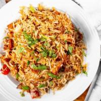 Vegetable Fried Rice · Basmati rice cooked with fresh vegetables flavored with herbs.