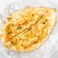 Garlic Naan · Unleavened bread topped with mildly spiced fresh garlic.