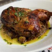 Chicken Tajine · Slow cooked aromatic half of chicken, fresh herbs, green olive and preserve lemon.