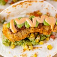 Baja Style Fish Tacos (2) · Crispy fish, smoked avocado salsa verde, chipotle mayo, grilled corn pico de gallo, on flour...