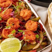 Fajitas Camarones · Build your own taco with grilled shrimps, onions, peppers, guacamole, salsa roja, pico de ga...