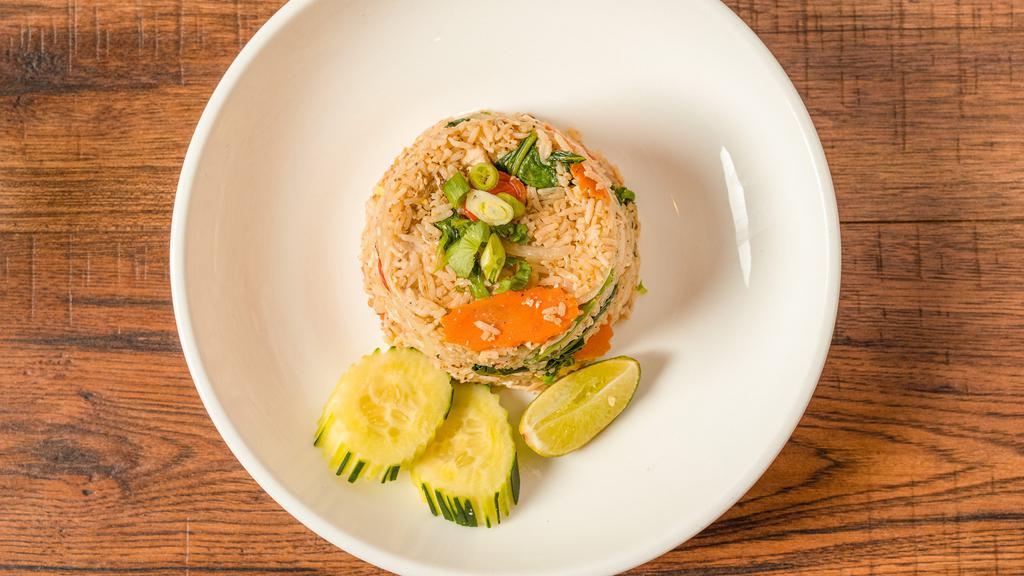 Thai Fried Rice · Thai style fried rice with egg, Chinese broccoli, carrot, onion, scallion, and cherry tomato.