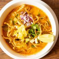 Kao Soy Noodle · Spicy. Egg noodle in Northern style curry topped with cilantro, red onion, pickled mustard g...