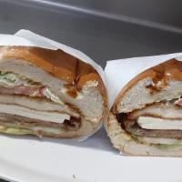 Super Tortas · Two meats. Served with refried beans, lettuce, tomatoes, onions, avocado, cheese, jalapenos ...