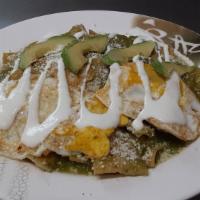 Chilaquiles With 2 Eggs · Served with salsa Verde, salsa rojo, tortillas and cream.