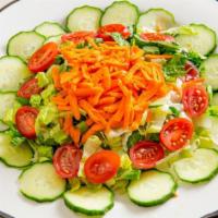 Aunt Norma'S Fresh Garden Salad   · Field Green Salad with Cherry Tomatoes, Cucumbers, Baby Corn with Basil Vinaigrette.
