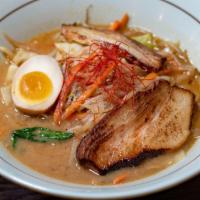 Miso Ramen · Favorite. Sapporo style miso infused with tonkatsu broth. Stir fried vegetables. Topped with...