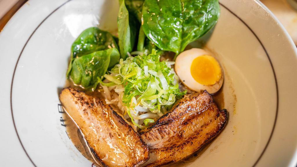 Black Ramen · Tonkatsu broth with smoky seafood flavor and noodles. Topped with bean sprouts, scallions, spinach, marinated egg, and grilled pork.