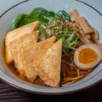 Veggie Shoyu Ramen · Rich soy based soup in noodles. Topped with bean sprouts, scallions, spinach, fried tofu, ba...