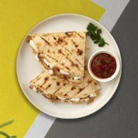 Plant-Based Quesadilla · Grilled beyond meat, chili beans, black beans, pico de Gallo, sriracha mayo over a whole whe...