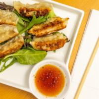 Vegetable Gyoza (6 Pcs) · Pan fried vegetable dumplings.