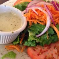 House Salad · Crisp mixed greens with tomatoes, carrots, onions, olives and aside of our homemade vinaigre...