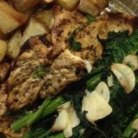 Grilled Chicken & Broccoli Rabe · Served with broccoli rabe and roasted potatoes.