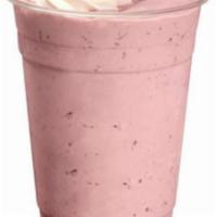 Strawberry Milkshake · Creamy Strawberry milkshake topped with whipped cream
