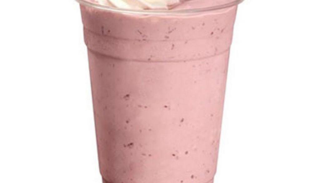 Strawberry Milkshake · Creamy Strawberry milkshake topped with whipped cream