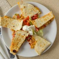 Chicken Quesadillas · Peppers, onions, sour cream, salsa