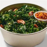 Cashew Kale Caesar With Seasoned Breadcrumbs · Tuscan and green kale, spicy cashews, shaved cauliflower, cashew Caesar dressing with breadc...