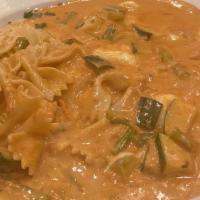 Farfalle Giabretti · Bowtie pasta in a tomato cream vodka sauce topped with fresh Mozzarella, zucchini and aspara...