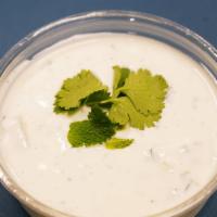 Yougrat Cucumber Salad · Contains dairy. Fresh mint, dived garlic, fresh cucumber and yogurt base. Served with a side...