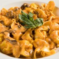 Fioretti Alla Boscaiola · Stuffed pasta in a mushroom, prosciutto cream sauce.(not available in gluten free or whole w...
