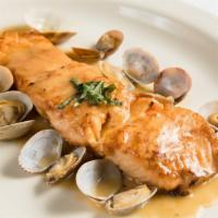 Salmon Luciano · With baby clams in a wine sauce.
