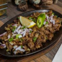 Pork Sisig · chopped lechon pork, seasoned and with onions.
