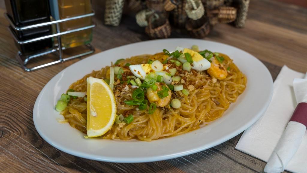 Palabok (Noodles) · Rice noodles with tasty shrimp sauce topped with smoked fish flakes, pork chicharrón, shrimps, hard-boiled eggs, scallions & fried garlic.