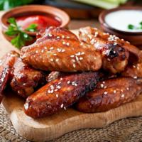 Chipotle Bbq Bone-In Chicken Wings (6) · Fresh wings crisp to perfection tossed in chipotle BBQ sauce.