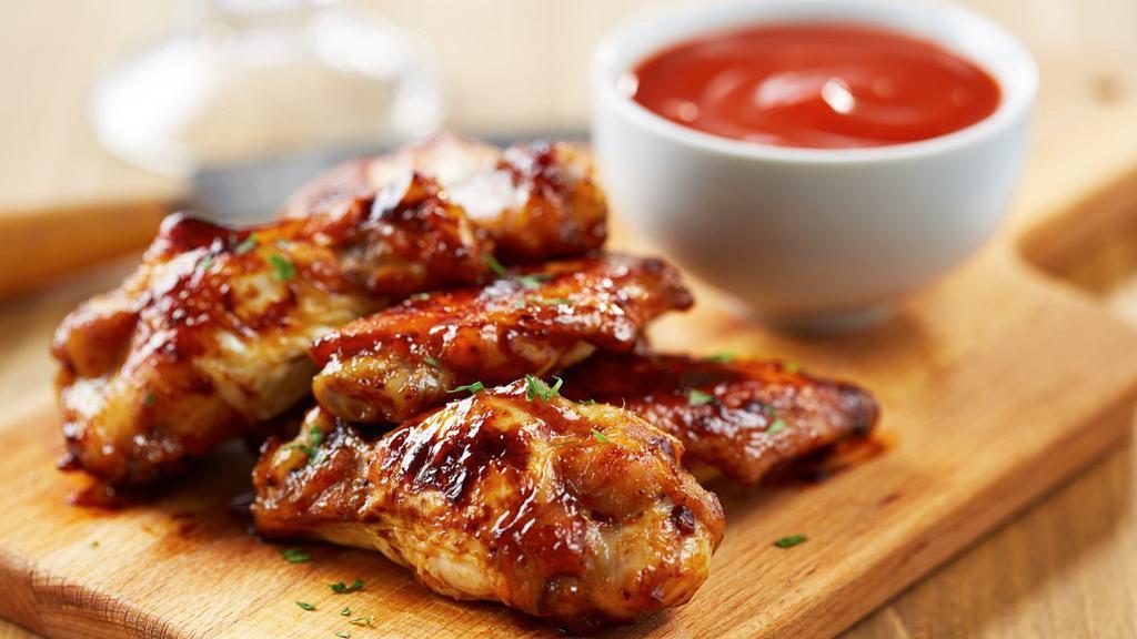 Honey Bbq Wings (7 Pieces) · Flavorful classic and deep fried bone in wings tossed in honey BBQ sauce.