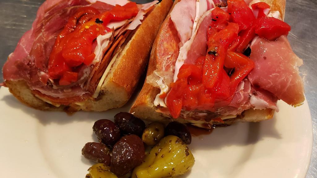 The Goodfella · Prosciutto, soppressata. Ham, pepperoni and provolone cheese, with roasted red peppers. Served on a baguette.
