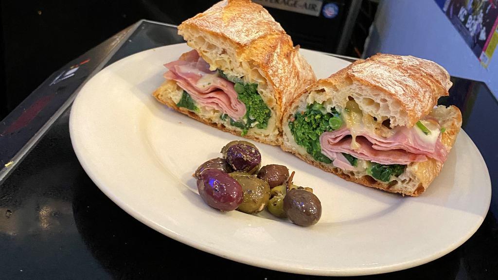 Little Piggy · Grilled black forest ham with broccoli rabe, honey mustard spread, topped with melted fontina cheese.