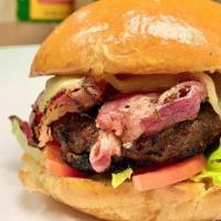 Pastrami Burger · HankBurger topped with NY  navel pastrami, Swiss cheese, hank sauce, onion, lettuce and tomato