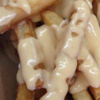 Truffle Cheese Fries · Our great fries with truffle cheese sauce (on the side).