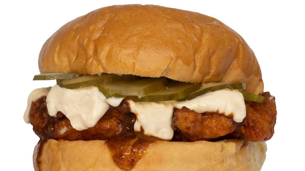 Nashville Hot Chicken Sandwich · Southern fried thigh, spicy hot sauce, mayo, dill pickles