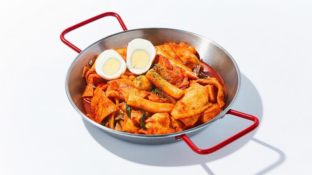 Rice Cake And Fish Cake In Spicy Sauce · Rice and fish cakes cooked in house spicy sauce with assorted vegetables and a boiled egg. Spicy.