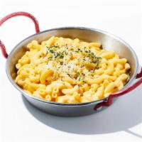 Mac And Cheese · Creamy and simple elbow macaroni with melted mozzarella and parmesan cheese.