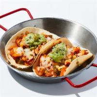 Peli Shrimp Taco · 2 pieces of white corn tortillas topped with marinated Shrimp, cilantro corn salad, assorted...