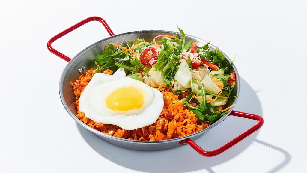 Kimchi Fried Rice With Egg · Fried rice with kimchi, ham and finished with sunny-side up egg.