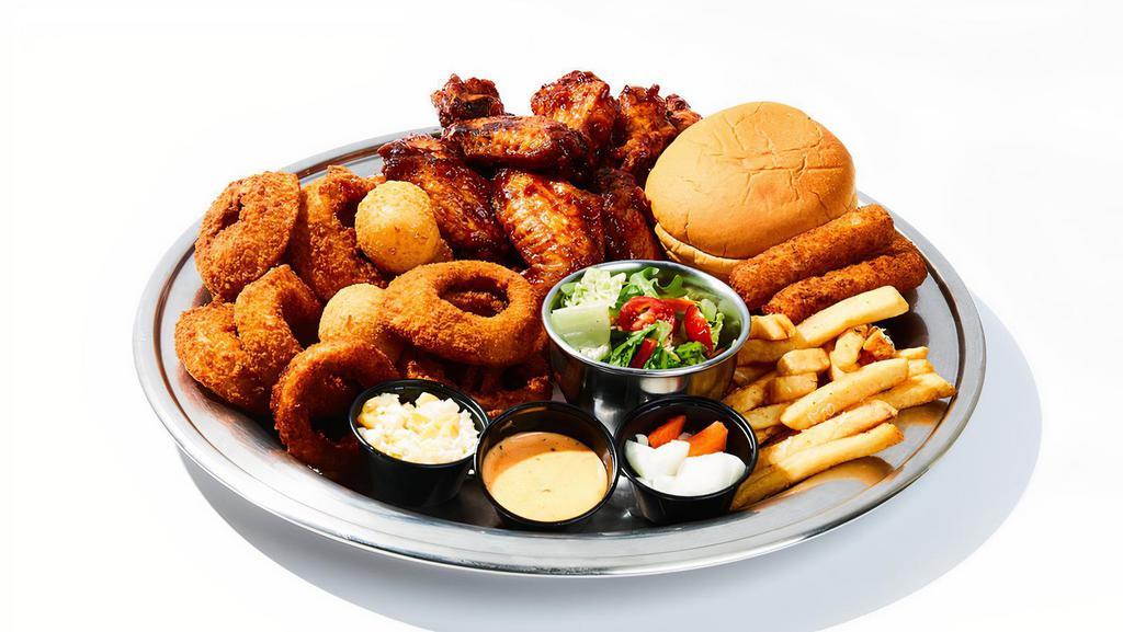 Grilled Wings Combo (C) · 20 pieces of grilled wings with side of fries, mozzarella sticks, onion rings, 2pcs cheese ball, corn salad & garden salad, bun. Served with side of spicy mayo & tomato sauce.