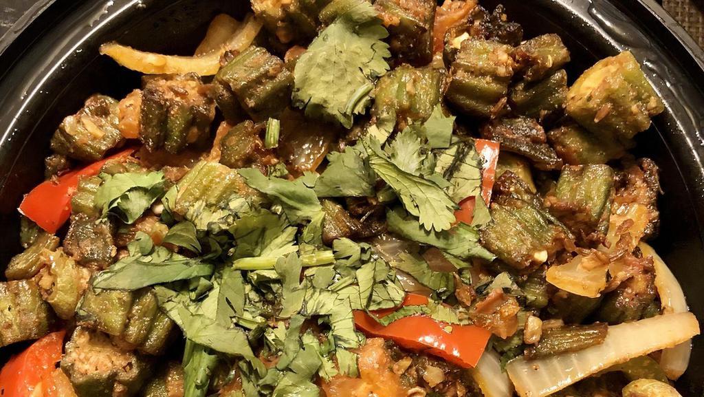 Bhindi Masala · Vegan, gluten-free. Okra sautéed with onions and tomatoes in a spicy gravy.  Served with Rice.