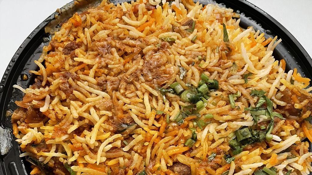 Goat Dum Biryani · Goat on bones is cooked in Basmati rice with spices and gravy in a very special way to capture the aroma.