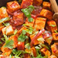 Chili Paneer · Sliced pieces of cottage cheese sauted with garlic, ginger, green peppers and spring onions