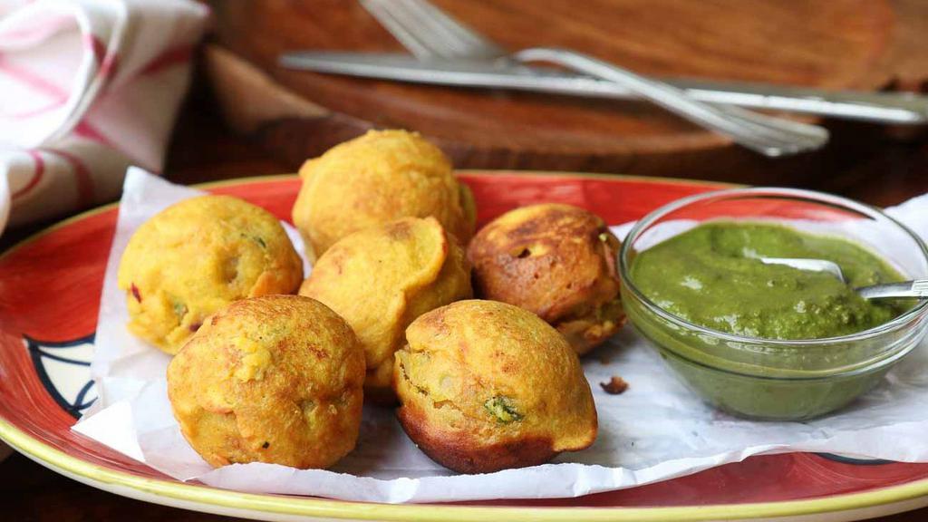 Alu Bonda (2 Pieces) · Spicy potato filling is wrapped with a crispy chickpea flour covering