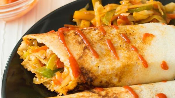 Spring Dosa · Crepe (made with rice and lentil dough) stuffed with potatoes, onions and mixed veggies