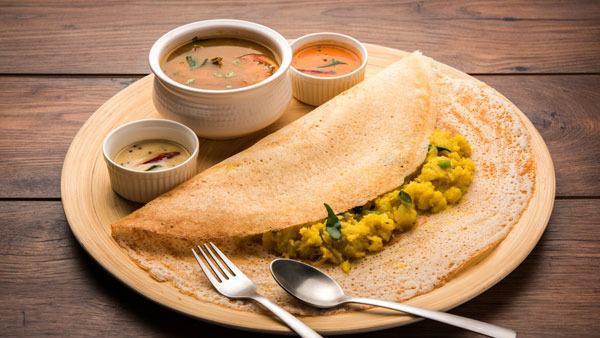 Masala Dosa · Crepe (made with rice and lentil dough) stuffed with potatoes, onions and nuts