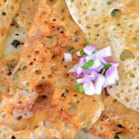 Onion Rava Dosa · Crispy thin crepe made of cream of wheat and rice flour with onions