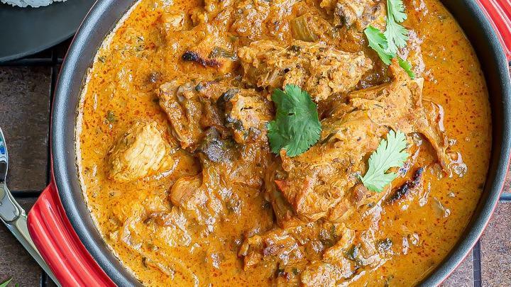 Chicken Korma · Chicken pieces cooked in a sauce of onions, tomatoes, coconut, poppy seeds, and Indian spices