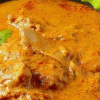 Goat Korma · Goat pieces cooked in curry sauce, Indian spices and herbs