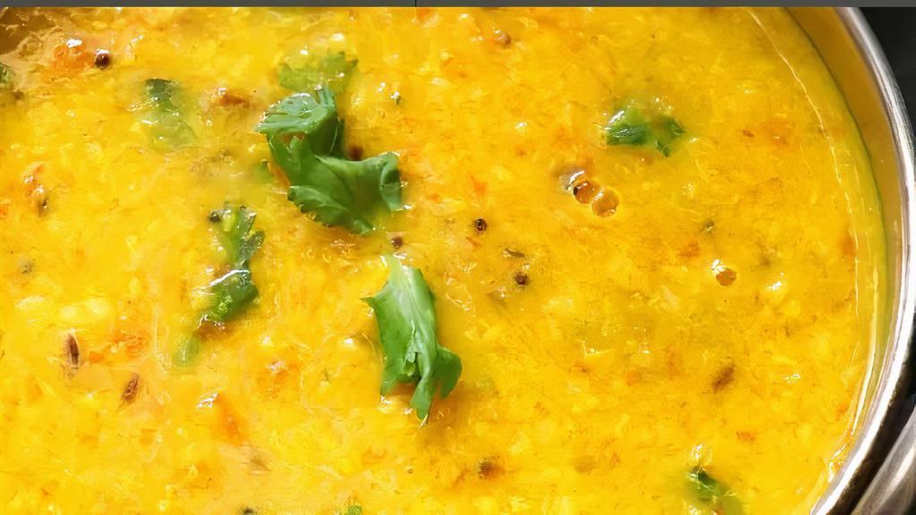 Yellow Daal · Yellow lentils cooked with onions, tomatoes and spices