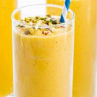 Mango Lassi · Yogurt and mango pulp blended with sugar